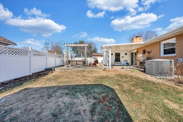 view of yard featuring a patio and central AC