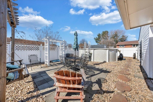 view of patio featuring a pool