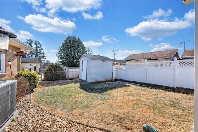 view of yard with cooling unit and a shed