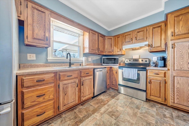 kitchen featuring sink, ornamental molding, and appliances with stainless steel finishes