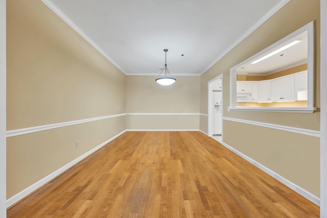 3040 Mcvitty Forest Dr Unit 211, Roanoke, VA 24018 - unfurnished dining area featuring crown molding, baseboards, and light wood-type flooring