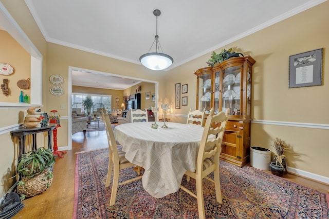 3040 Mcvitty Forest Dr Unit 211, Roanoke, VA 24018 - dining room with crown molding, baseboards, and wood finished floors