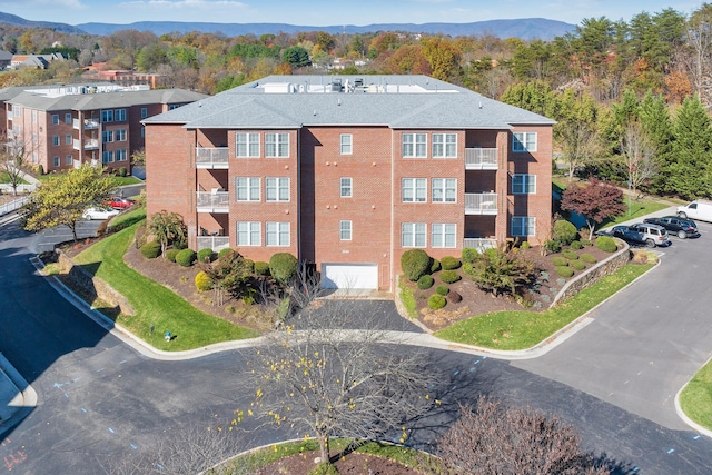3040 Mcvitty Forest Dr Unit 211, Roanoke, VA 24018 - view of property with driveway, a mountain view, and a garage