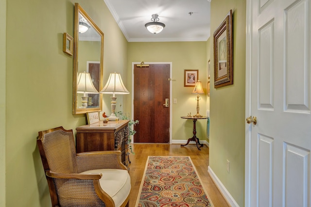 entryway featuring crown molding and light hardwood / wood-style flooring