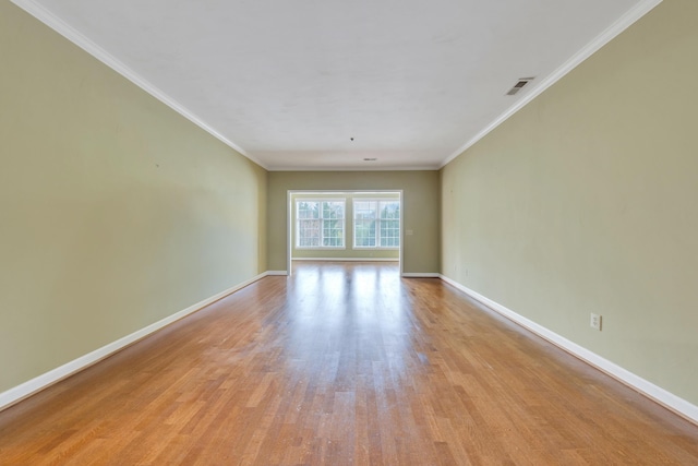 3040 Mcvitty Forest Dr Unit 211, Roanoke, VA 24018 - unfurnished room featuring baseboards, visible vents, ornamental molding, and light wood-style flooring