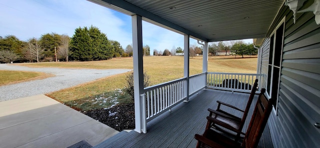 view of dock featuring a lawn