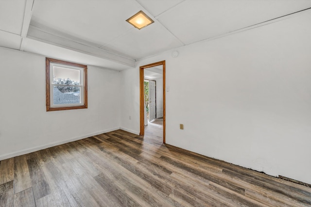 spare room featuring dark hardwood / wood-style flooring