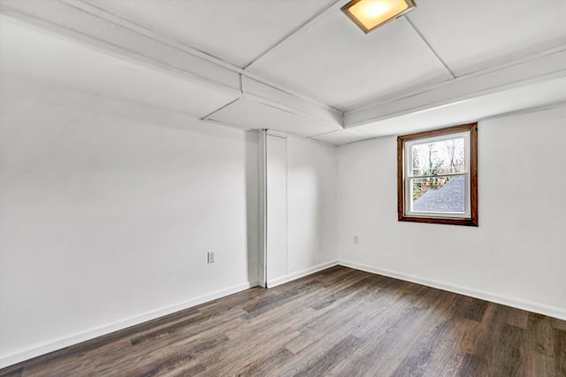 spare room with dark hardwood / wood-style floors