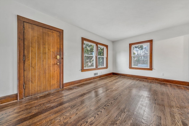 entrance foyer featuring dark hardwood / wood-style floors