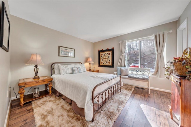 bedroom featuring dark hardwood / wood-style flooring