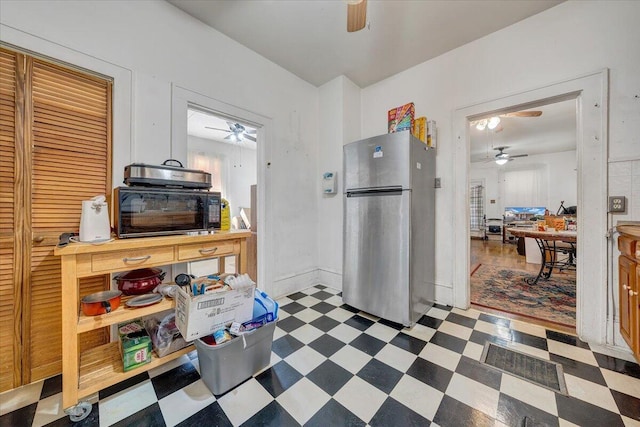 kitchen featuring stainless steel fridge and ceiling fan