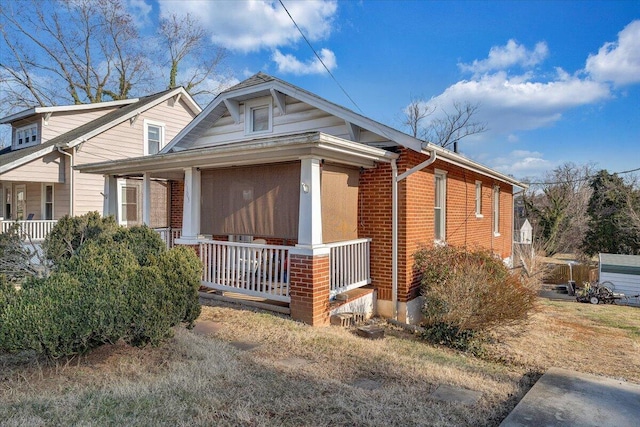 view of property exterior with covered porch