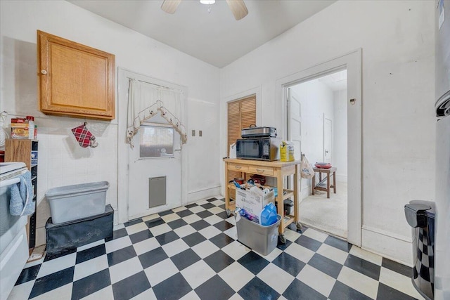 kitchen featuring light brown cabinets and ceiling fan