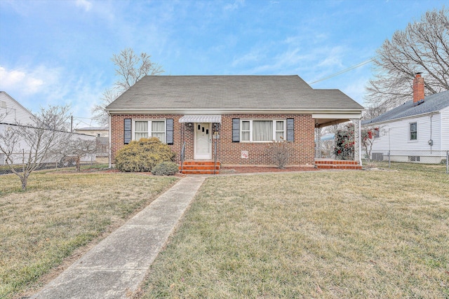 bungalow-style home with a front yard