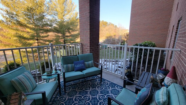 view of pool featuring a patio and a water view