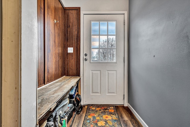 mudroom with wood finished floors and baseboards