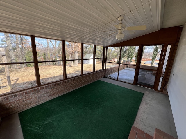 unfurnished sunroom featuring vaulted ceiling and ceiling fan