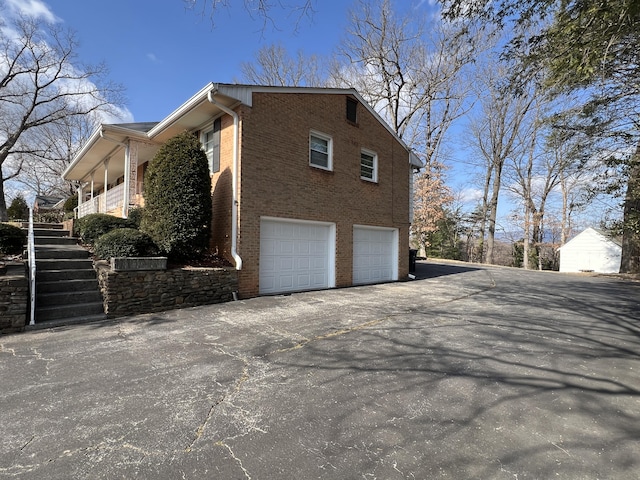 view of side of property featuring a garage