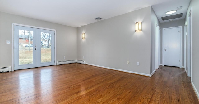 unfurnished room with a baseboard heating unit, dark hardwood / wood-style flooring, and french doors