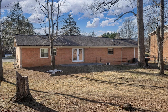 back of property featuring cooling unit and french doors