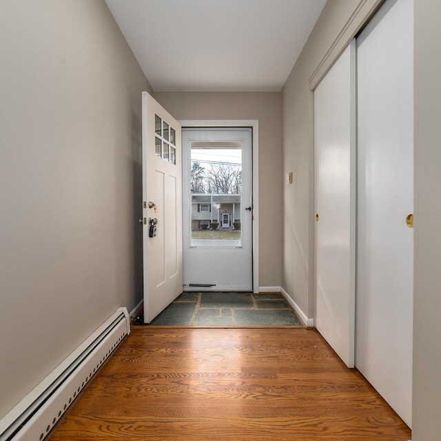 entryway featuring dark hardwood / wood-style floors and baseboard heating