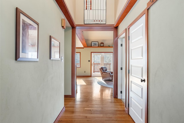 hall with light hardwood / wood-style floors