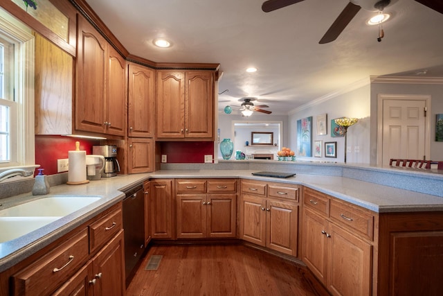 kitchen with dishwashing machine, a ceiling fan, a peninsula, dark wood-style flooring, and a sink