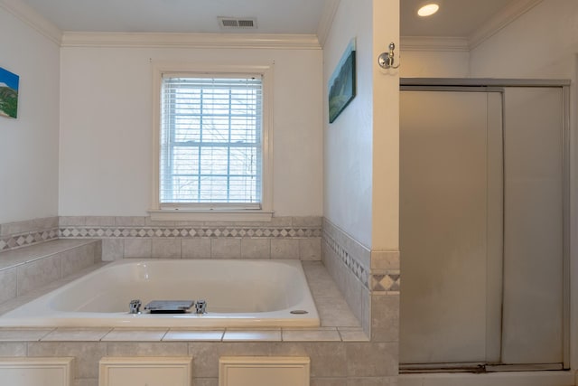 bathroom with a garden tub, a stall shower, visible vents, and ornamental molding