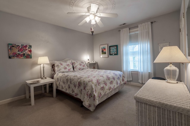 bedroom with carpet flooring, baseboards, visible vents, and ceiling fan