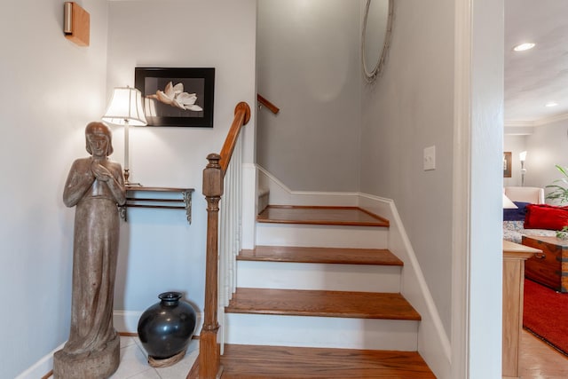 stairs featuring recessed lighting and crown molding