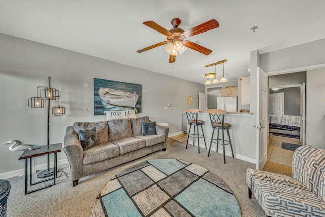 carpeted living room featuring ceiling fan