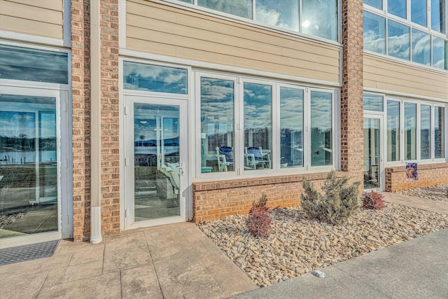 doorway to property featuring a patio