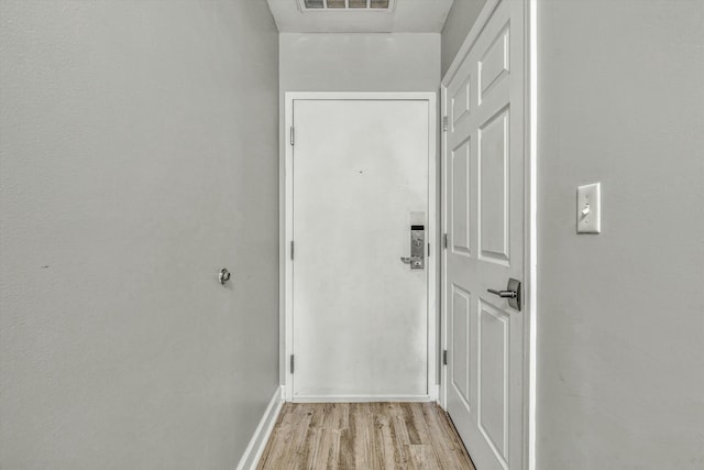 doorway to outside with light wood-type flooring