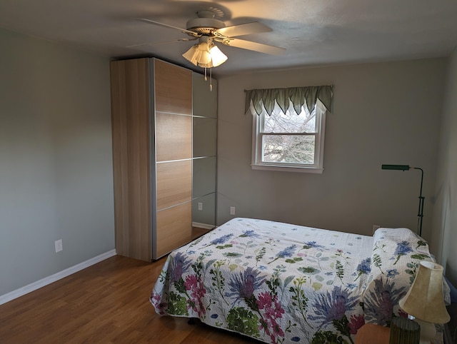 bedroom featuring ceiling fan and hardwood / wood-style floors