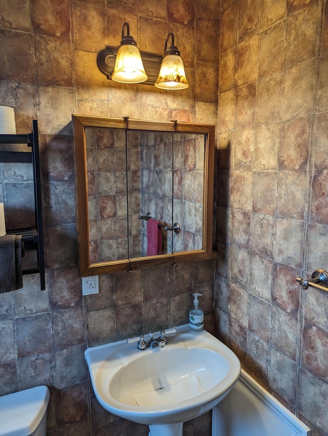 bathroom with sink and toilet