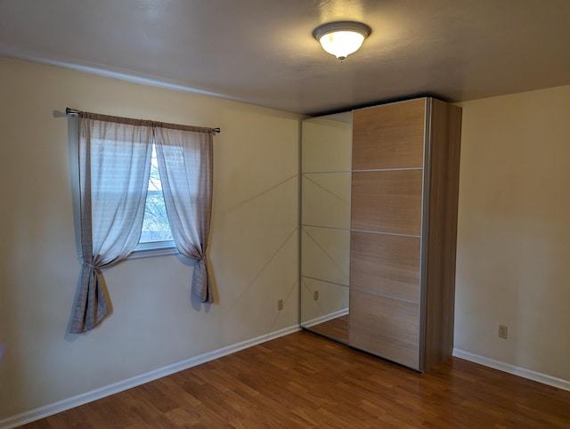 unfurnished bedroom featuring hardwood / wood-style floors