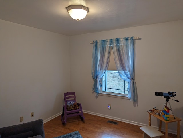 sitting room featuring hardwood / wood-style flooring