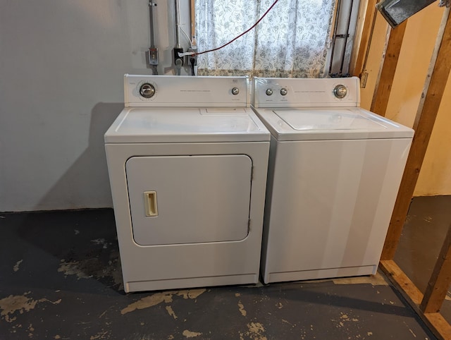 washroom with washing machine and clothes dryer