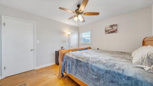 bedroom featuring ceiling fan and light hardwood / wood-style flooring