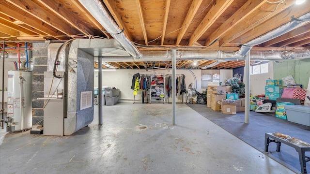 basement with heating unit and gas water heater