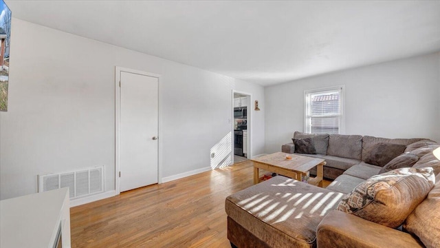 living room featuring light wood-type flooring