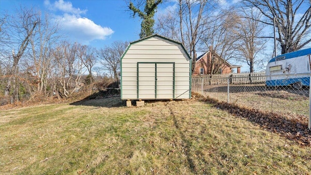 view of outbuilding with a yard