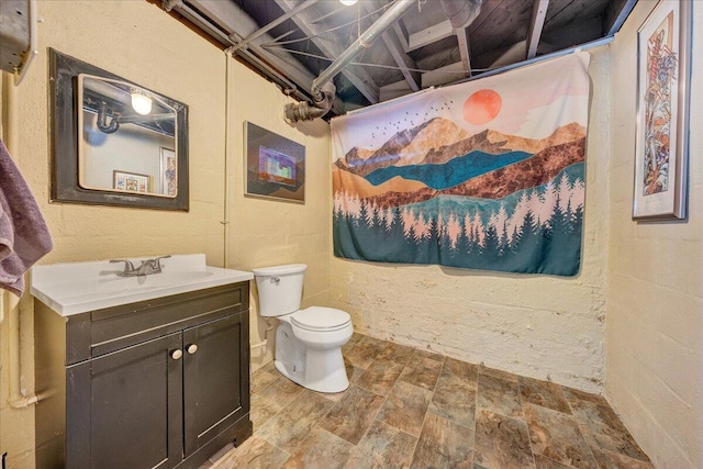 bathroom with vanity and toilet