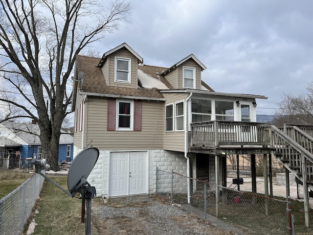 view of front of house featuring a deck and a sunroom