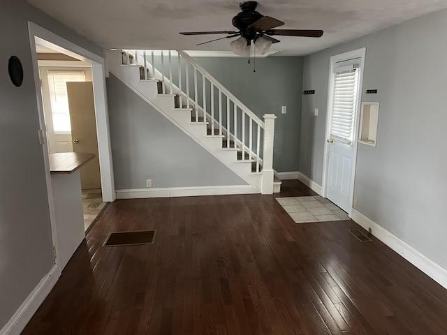 foyer entrance with hardwood / wood-style floors and ceiling fan