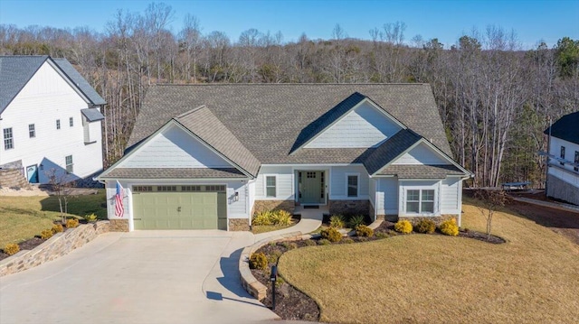 craftsman inspired home with a garage and a front yard