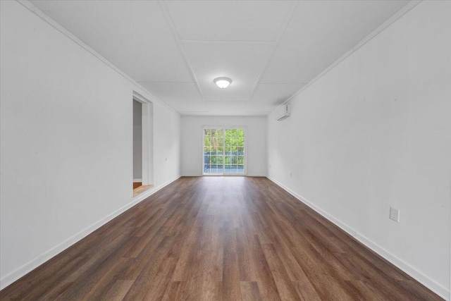 empty room with wood finished floors and baseboards