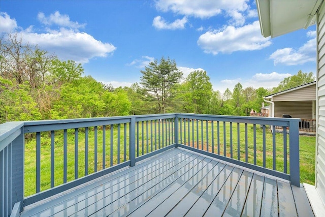 wooden deck with a lawn