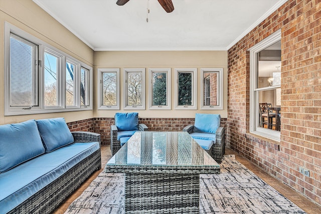 sunroom / solarium with ceiling fan