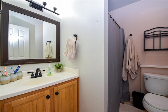 bathroom with vanity and toilet